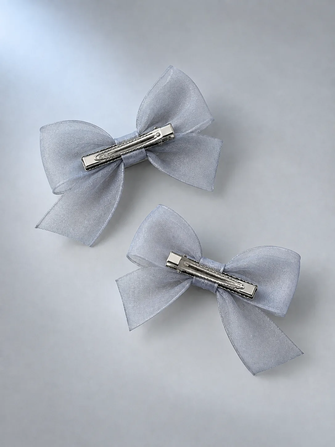 Sheer Bow Clip Pair in Moon Grey, back view