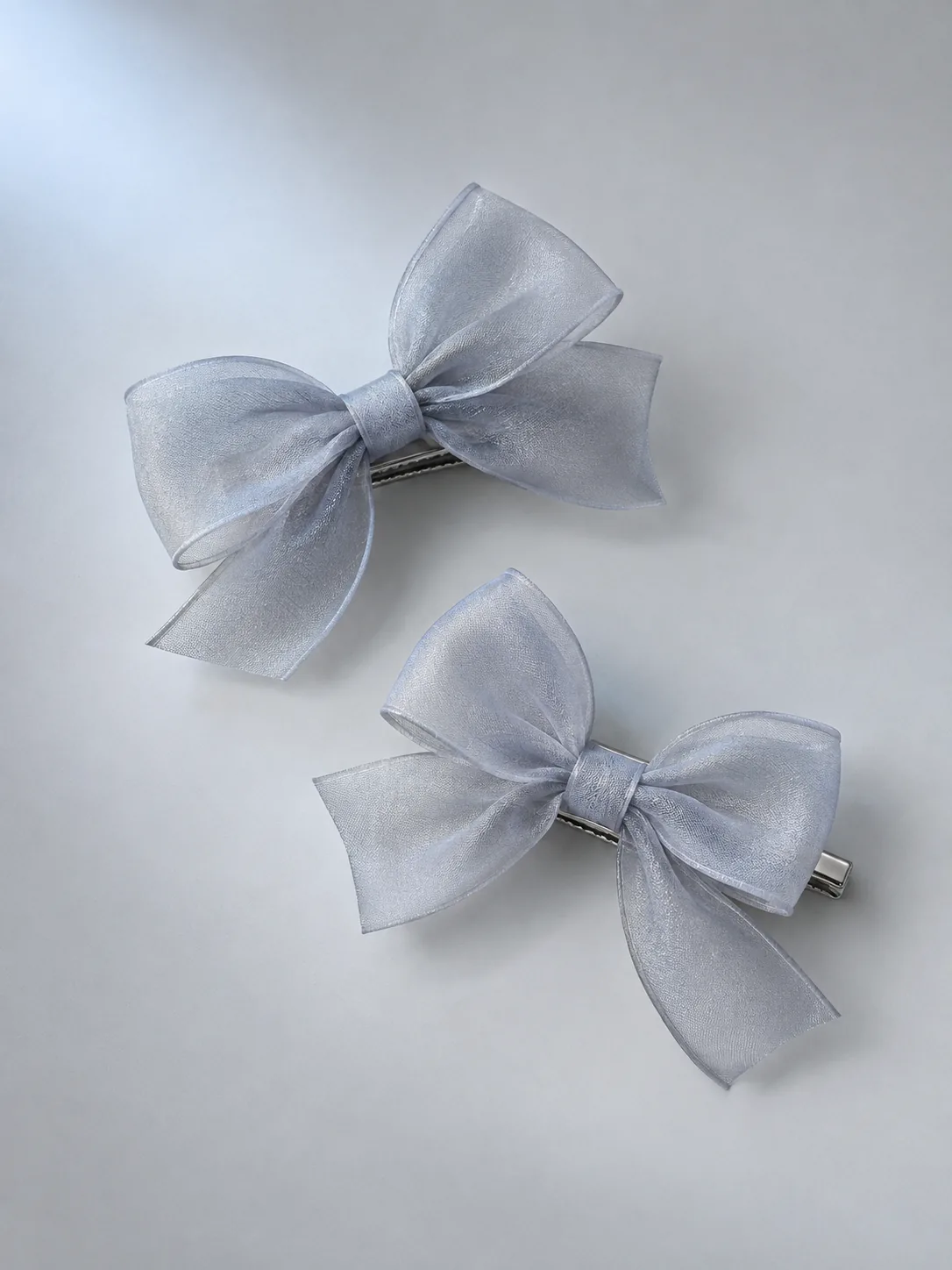 Sheer Bow Clip Pair in Moon Grey, front view